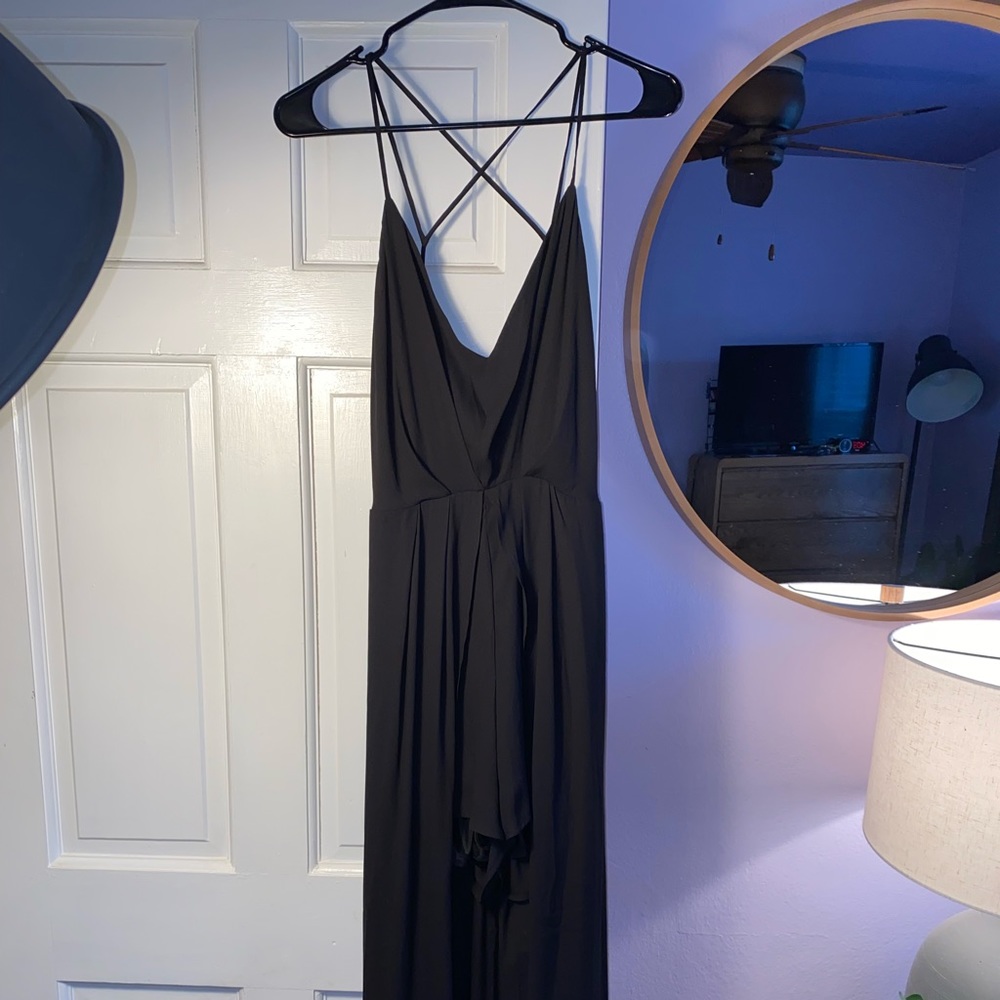 Black romper with flowy back size large never worn